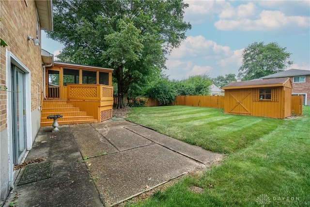 702 W Sharon Rd, Forest Park, OH 45240 - fenced backyard with a storage shed, a patio area, and a sunroom