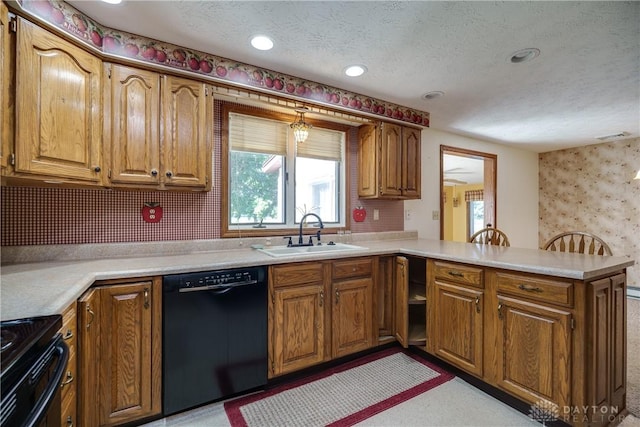 789 W Krepps Rd, Xenia, OH 45385 - kitchen featuring black appliances, a peninsula, brown cabinets, a textured ceiling, and light countertops