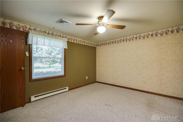 789 W Krepps Rd, Xenia, OH 45385 - spare room featuring a baseboard radiator, carpet floors, and a ceiling fan