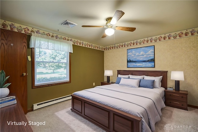 789 W Krepps Rd, Xenia, OH 45385 - bedroom with a baseboard heating unit, light carpet, and a ceiling fan