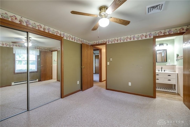 789 W Krepps Rd, Xenia, OH 45385 - unfurnished bedroom featuring a baseboard radiator, carpet floors, and a closet
