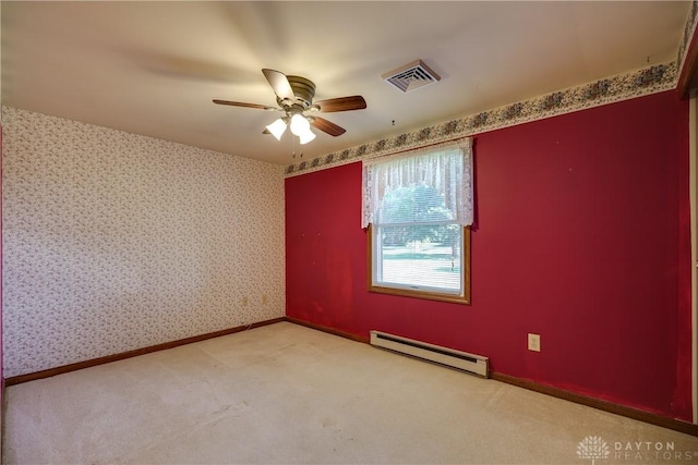 789 W Krepps Rd, Xenia, OH 45385 - spare room featuring a baseboard heating unit, ceiling fan, and carpet flooring