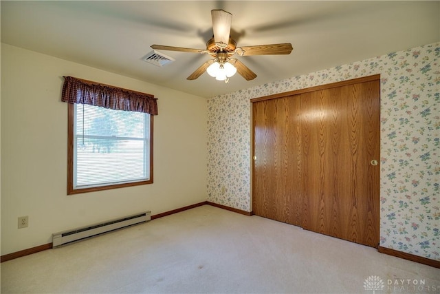 789 W Krepps Rd, Xenia, OH 45385 - unfurnished bedroom featuring a baseboard radiator, wallpapered walls, carpet flooring, a closet, and ceiling fan