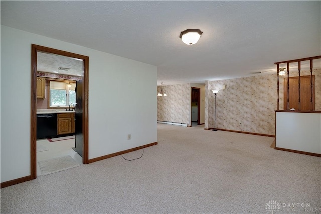 789 W Krepps Rd, Xenia, OH 45385 - spare room with light carpet, a baseboard radiator, and wallpapered walls