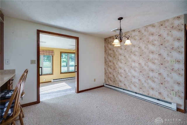 789 W Krepps Rd, Xenia, OH 45385 - unfurnished dining area featuring a baseboard radiator, baseboard heating, carpet flooring, a chandelier, and an accent wall