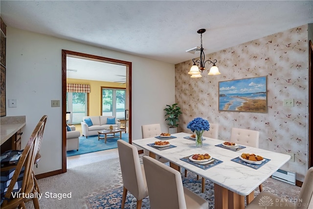 789 W Krepps Rd, Xenia, OH 45385 - dining room with an accent wall, light colored carpet, wallpapered walls, a chandelier, and a baseboard radiator
