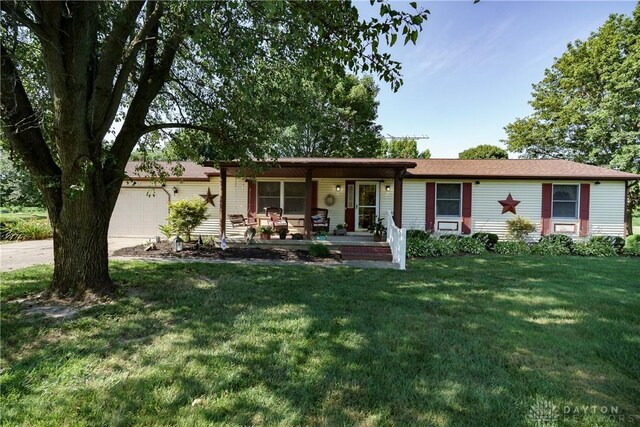 789 W Krepps Rd, Xenia, OH 45385 - ranch-style home featuring a porch, a garage, and a front yard