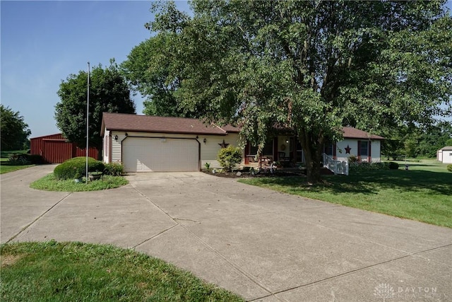 789 W Krepps Rd, Xenia, OH 45385 - view of front of house featuring driveway, a front lawn, an attached garage, and covered porch