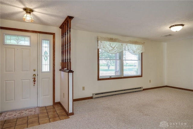 789 W Krepps Rd, Xenia, OH 45385 - entryway featuring a baseboard radiator, carpet flooring, and a textured ceiling