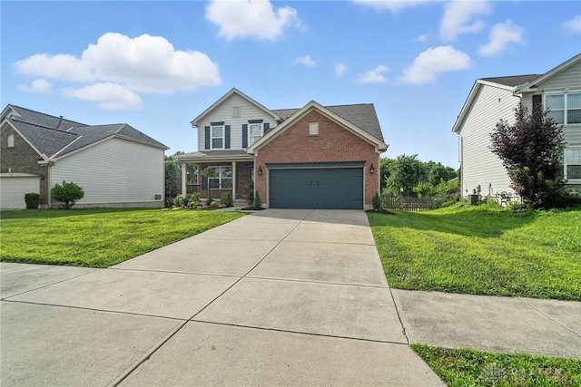 171 Shanda Dr, Monroe, OH 45050 - traditional-style house featuring brick siding, concrete driveway, and a garage