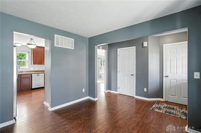 171 Shanda Dr, Monroe, OH 45050 - spare room featuring dark wood-style flooring and baseboards