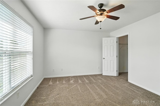 171 Shanda Dr, Monroe, OH 45050 - unfurnished bedroom featuring carpet, multiple windows, and a spacious closet