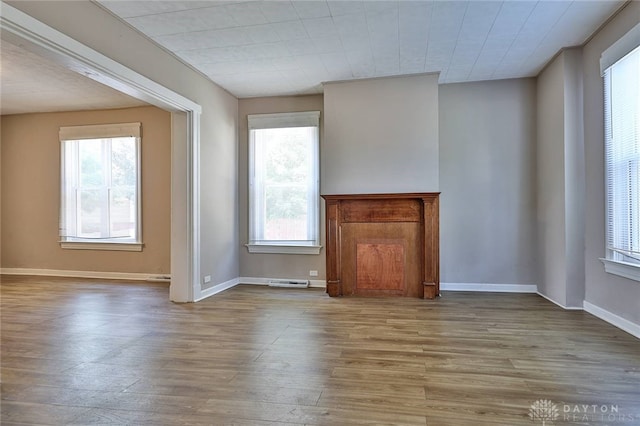 578 Considine Ave, Cincinnati, OH 45205 - unfurnished living room featuring wood finished floors and baseboards