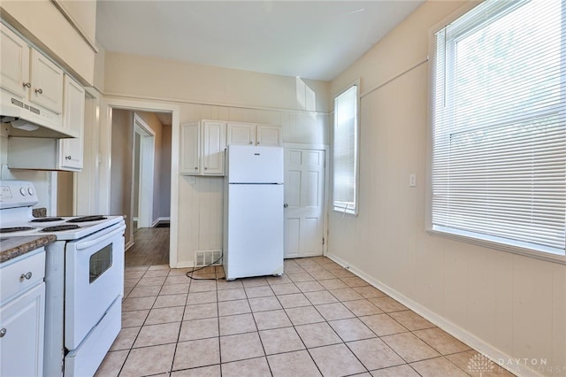 578 Considine Ave, Cincinnati, OH 45205 - kitchen featuring white appliances, under cabinet range hood, white cabinetry, and light tile patterned floors