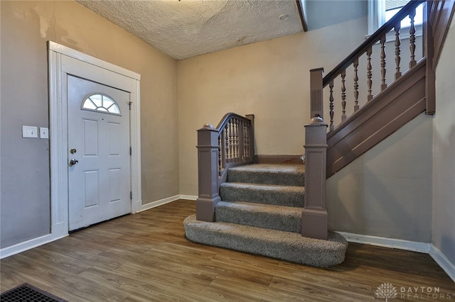 578 Considine Ave, Cincinnati, OH 45205 - entrance foyer featuring wood finished floors, stairway, and a textured ceiling