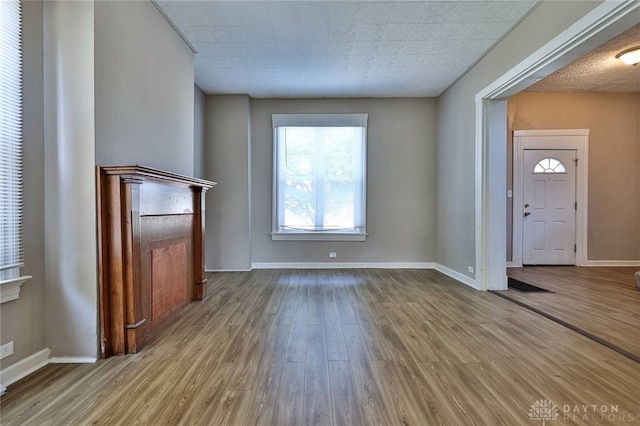 578 Considine Ave, Cincinnati, OH 45205 - unfurnished living room featuring wood finished floors and baseboards