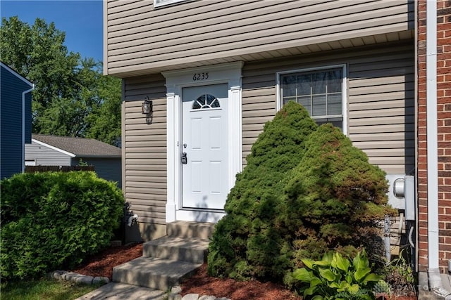 6235 Pheasant Hill Rd, Dayton, OH 45424 - doorway to property with brick siding