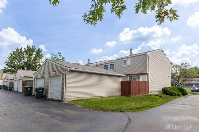 6235 Pheasant Hill Rd, Dayton, OH 45424 - view of property exterior with an outbuilding and a garage