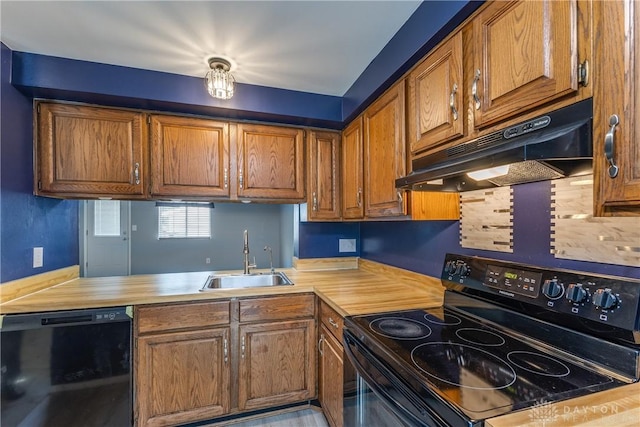 6235 Pheasant Hill Rd, Dayton, OH 45424 - kitchen with black appliances, under cabinet range hood, and brown cabinetry