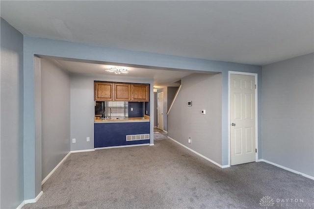 6235 Pheasant Hill Rd, Dayton, OH 45424 - kitchen featuring brown cabinets, carpet, and light countertops
