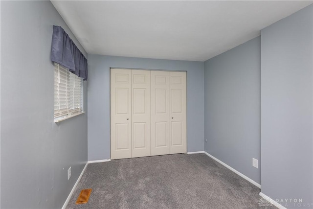 6235 Pheasant Hill Rd, Dayton, OH 45424 - unfurnished bedroom with carpet floors and a closet