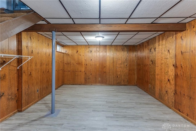 6235 Pheasant Hill Rd, Dayton, OH 45424 - finished below grade area featuring wood walls, wood finished floors, and a paneled ceiling