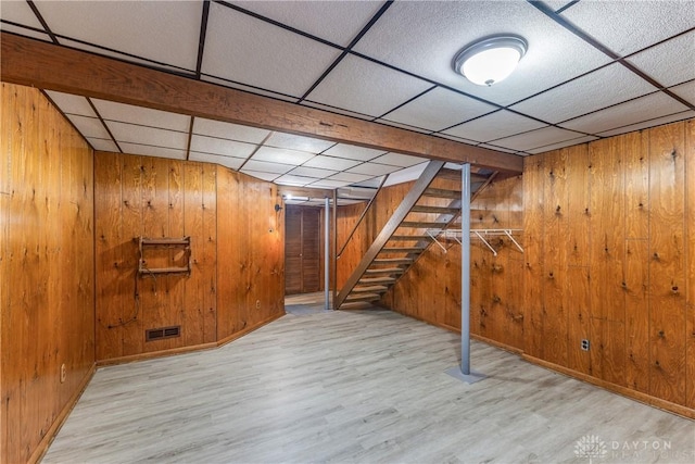6235 Pheasant Hill Rd, Dayton, OH 45424 - finished below grade area with wood finished floors, wooden walls, a drop ceiling, and stairs