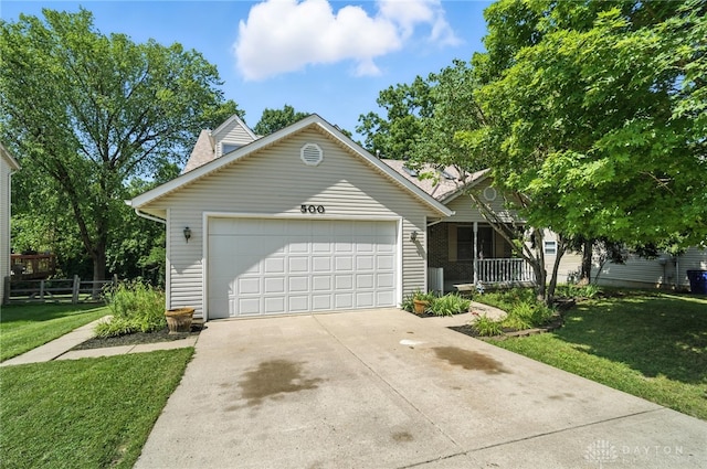 500 Smalley Blvd, Hamilton, OH 45013 - view of front of house with driveway, a garage, and covered porch