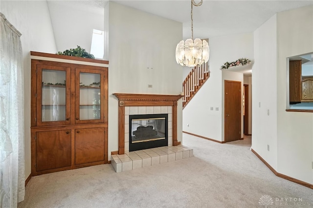 500 Smalley Blvd, Hamilton, OH 45013 - unfurnished living room featuring carpet floors, a chandelier, a fireplace, and a high ceiling