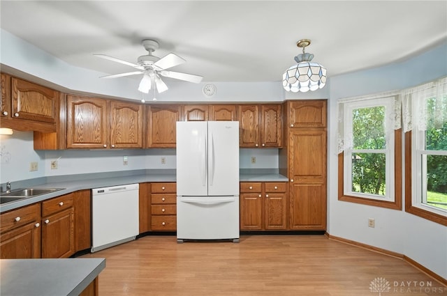 500 Smalley Blvd, Hamilton, OH 45013 - kitchen featuring white appliances, brown cabinets, and light wood-style flooring
