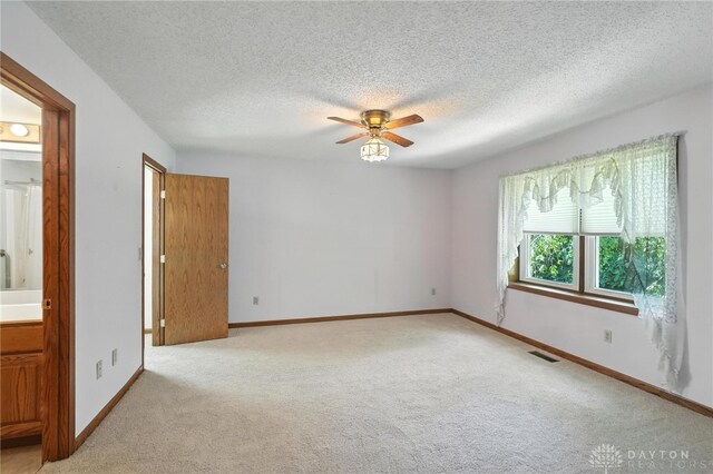 500 Smalley Blvd, Hamilton, OH 45013 - unfurnished room featuring carpet, ceiling fan, and a textured ceiling
