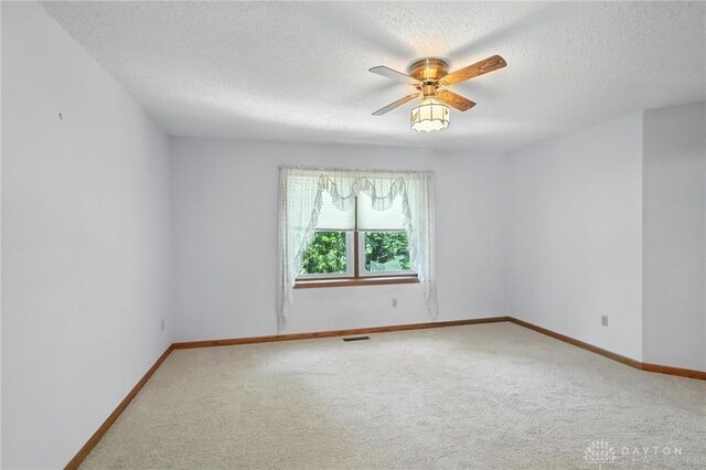 500 Smalley Blvd, Hamilton, OH 45013 - carpeted spare room featuring a textured ceiling and a ceiling fan