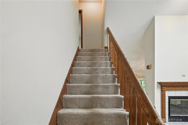 500 Smalley Blvd, Hamilton, OH 45013 - stairs featuring a tile fireplace