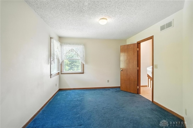 500 Smalley Blvd, Hamilton, OH 45013 - carpeted spare room with a textured ceiling and baseboards
