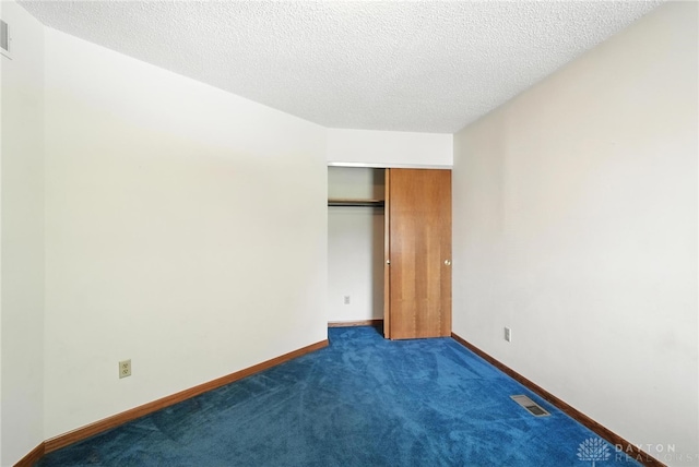 500 Smalley Blvd, Hamilton, OH 45013 - unfurnished bedroom featuring carpet floors, a textured ceiling, and a closet