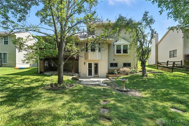 500 Smalley Blvd, Hamilton, OH 45013 - rear view of house with a lawn and a patio area