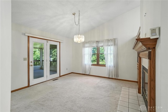 500 Smalley Blvd, Hamilton, OH 45013 - unfurnished dining area with a fireplace with flush hearth, carpet, a chandelier, and french doors