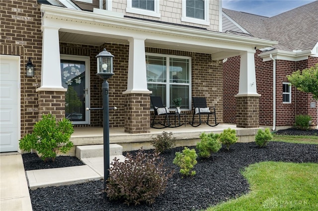 598 Twilight Ln, Dayton, OH 45440 - entrance to property featuring covered porch, brick siding, and roof with shingles
