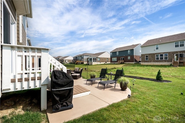 598 Twilight Ln, Dayton, OH 45440 - view of grassy yard with a residential view, a patio, and a wooden deck