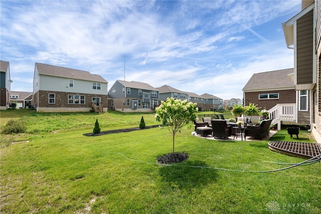 598 Twilight Ln, Dayton, OH 45440 - view of green lawn featuring an outdoor living space, a residential view, and a patio area