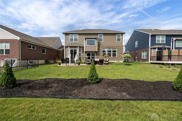 598 Twilight Ln, Dayton, OH 45440 - rear view of house with a patio and brick siding