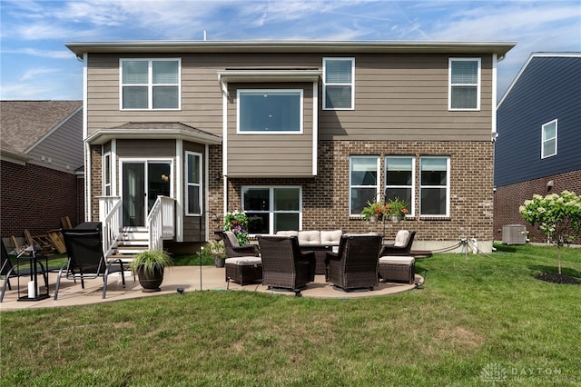 598 Twilight Ln, Dayton, OH 45440 - rear view of house with brick siding, a patio area, entry steps, and a yard