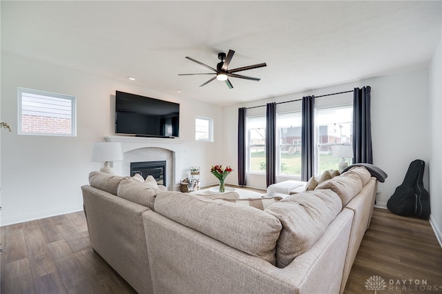 598 Twilight Ln, Dayton, OH 45440 - living area featuring a ceiling fan, a glass covered fireplace, dark wood-style floors, and recessed lighting