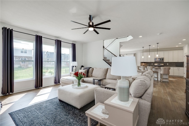 598 Twilight Ln, Dayton, OH 45440 - living area with stairway, a ceiling fan, wood finished floors, and recessed lighting