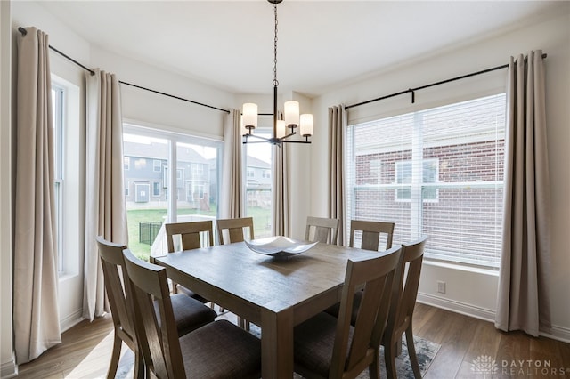 598 Twilight Ln, Dayton, OH 45440 - dining room featuring a chandelier and wood finished floors
