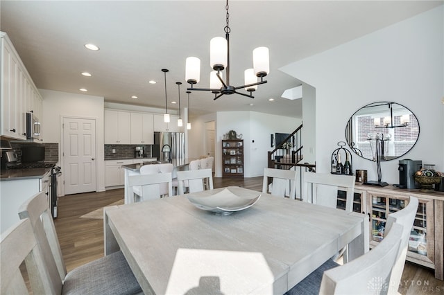 598 Twilight Ln, Dayton, OH 45440 - dining room featuring a chandelier, recessed lighting, dark wood-style floors, and stairs