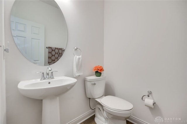 598 Twilight Ln, Dayton, OH 45440 - bathroom with toilet and wood finished floors