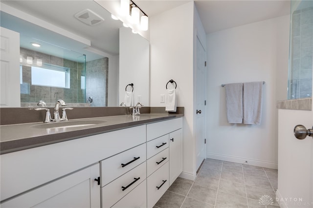598 Twilight Ln, Dayton, OH 45440 - bathroom with double vanity, tile patterned flooring, and tiled shower