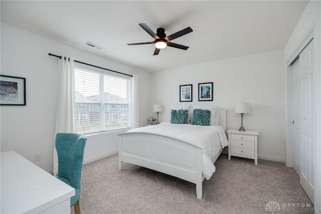 598 Twilight Ln, Dayton, OH 45440 - bedroom with light colored carpet, a closet, and ceiling fan