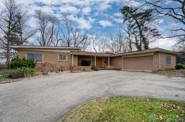 111 Folsom Dr, Dayton, OH 45405 - ranch-style home with driveway and an attached garage
